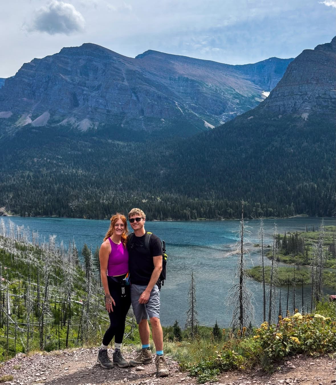 Jake and Em overlooking a mountain lake