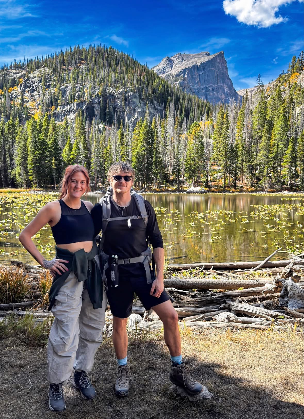 Jake and Em beside a beautiful mountain pond
