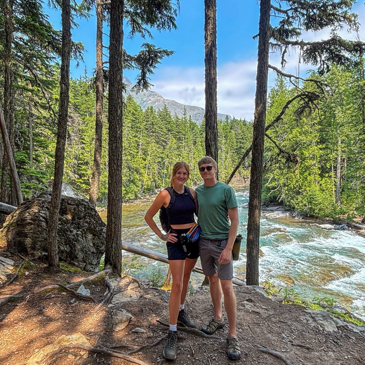 Jake and Em beside a mountain river
